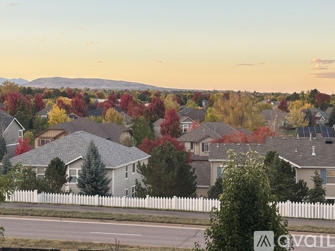 A suburban neighborhood with houses and trees.