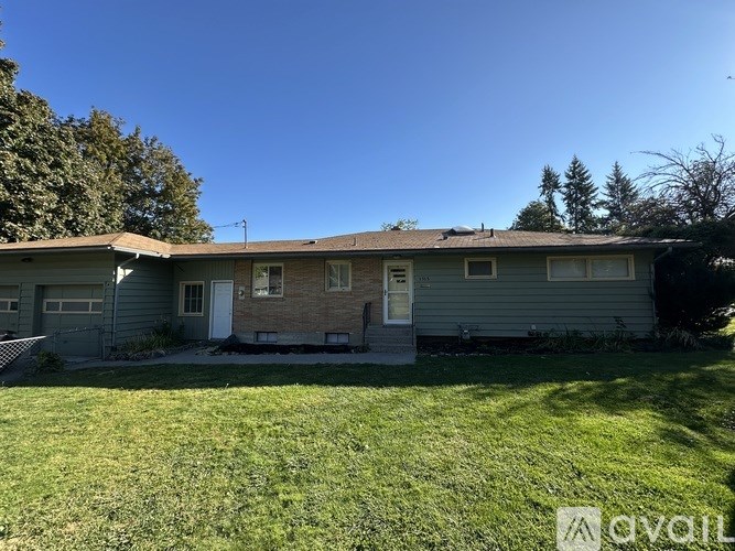 A house with a white door and a brown roof.