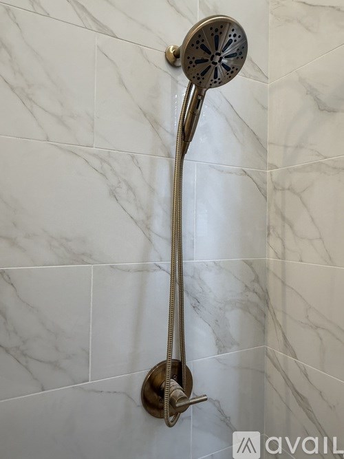 A shower head mounted on a wall.