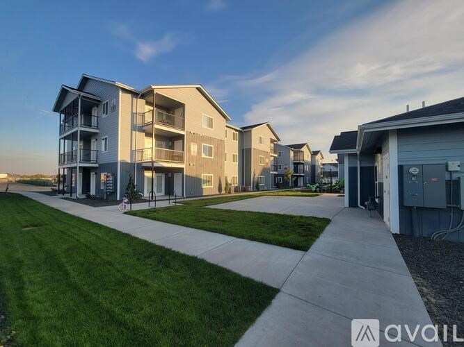 A modern apartment complex with a clear sky above.