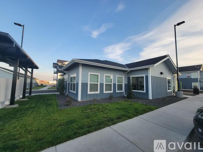 A row of houses with the first one for sale.