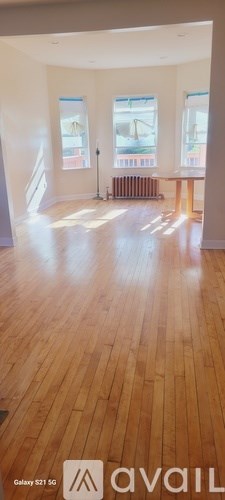 A room with wooden floors and white walls.