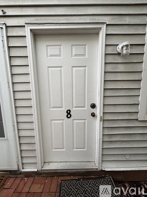 A white door with the number 8 on it.