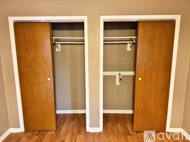 A white door with a wooden door on the other side.