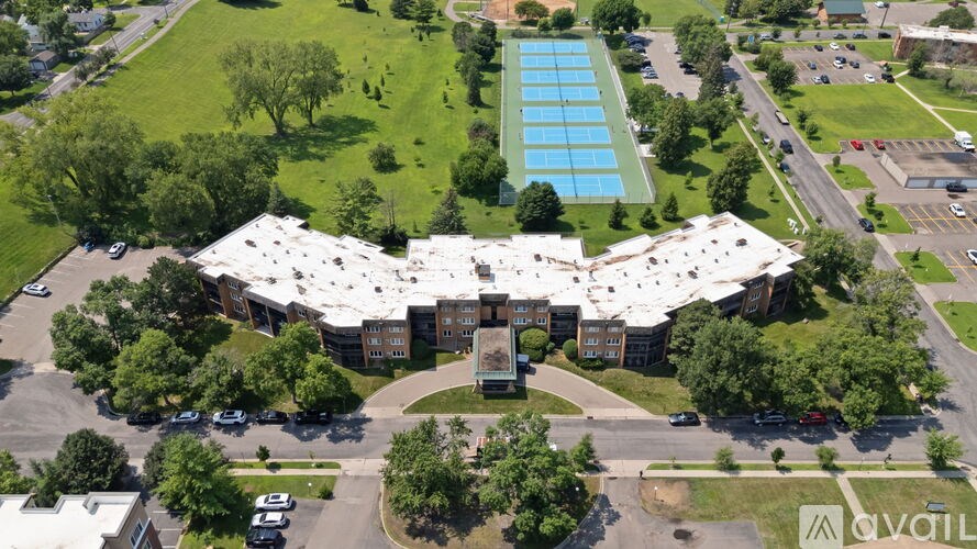 A large building with a pool in the middle of it.