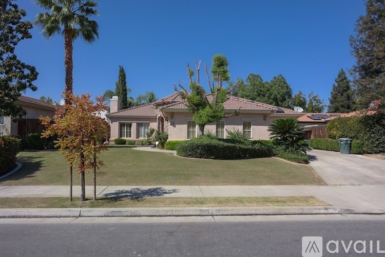 A house with a palm tree in front of it.