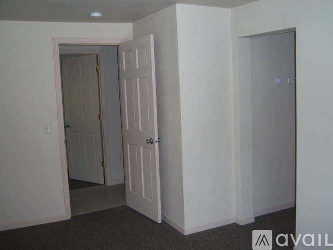 A room with a door and a wall with a door.