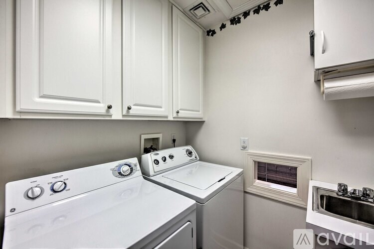 A white oven and dishwasher in a kitchen.