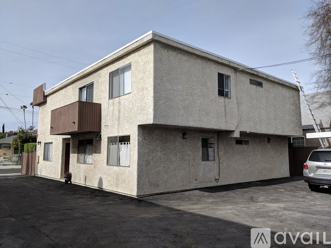 A white oven with a hose coming out of it.