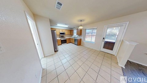 A room with white walls and a tiled floor.