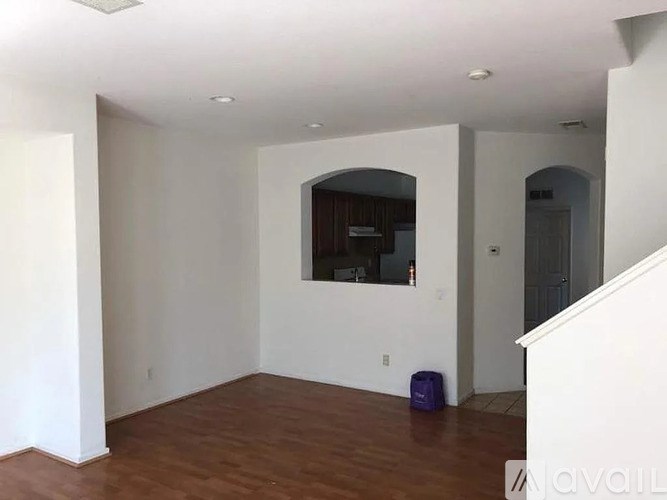 A room with a purple bag on the floor.