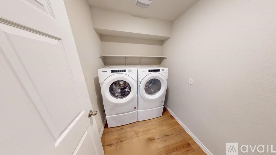 A laundry room with a washer and dryer.