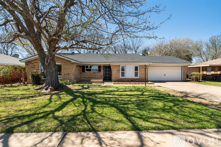 A house with a tree in front of it.
