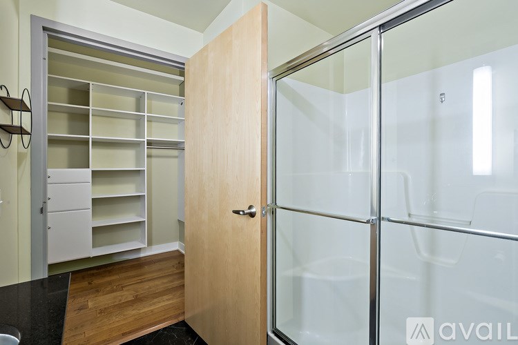 A wooden door with a glass panel to the right.