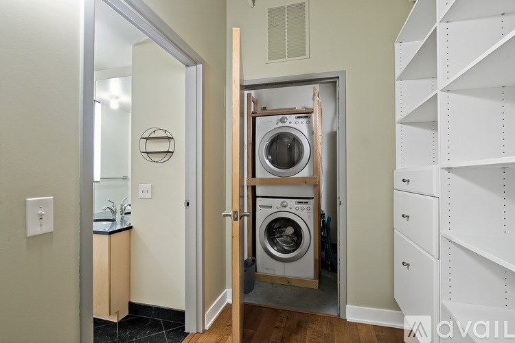 A laundry room with a washer and dryer in it.
