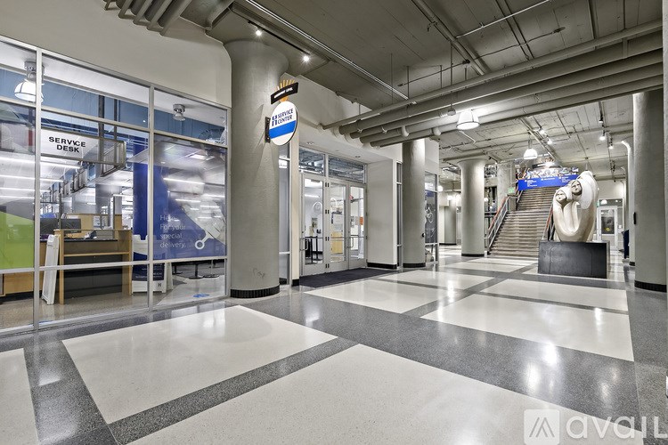 A hallway with a blue sign that says "Service Desk" on it.