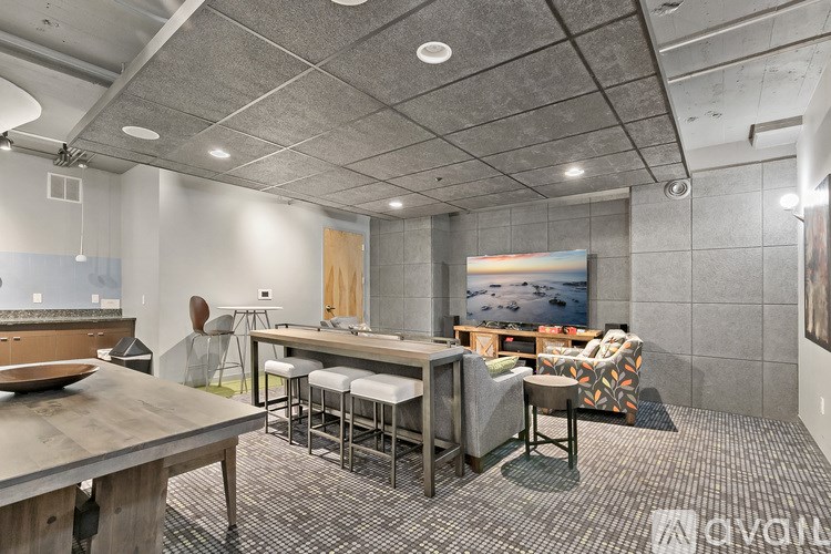 A modern kitchen with a dining table and chairs.