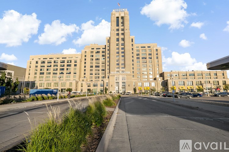 A large building with a sign that says "CITYHALL" on top of it.