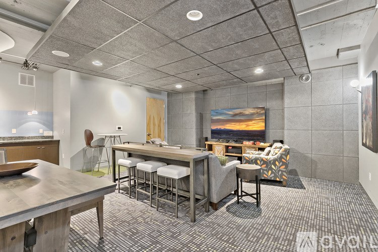 A modern kitchen with a dining table and chairs.