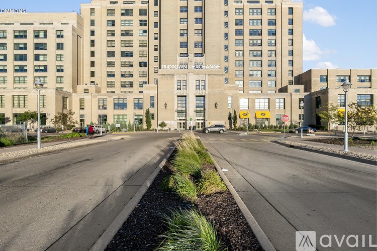 A street view of a building with the sign "INDIGROWN EXCHANGE" on it.