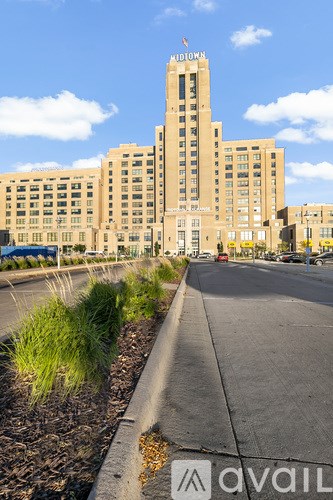 A tall building with the word "Midtown" on top of it.