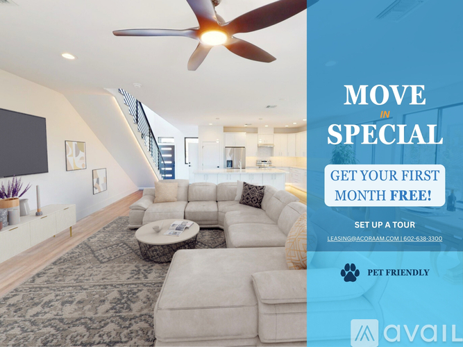 A living room with a large fan and a sign offering a free first month for a move-in special.