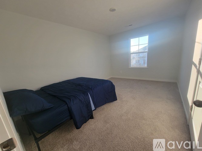 A modern living room with a fireplace and a flat screen TV mounted above it.