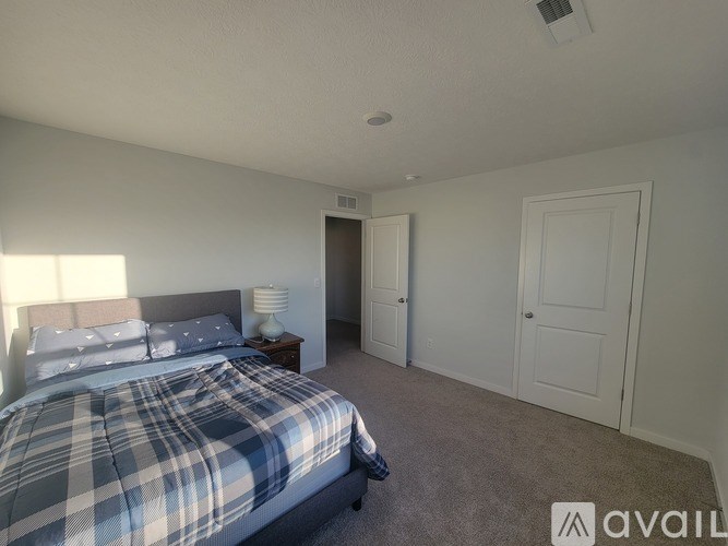 A modern kitchen with a stove top oven and microwave above it.