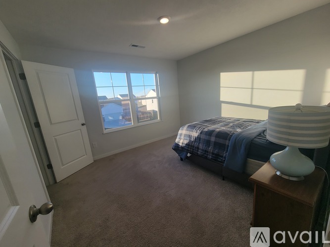 A modern kitchen with a dining table set for four.