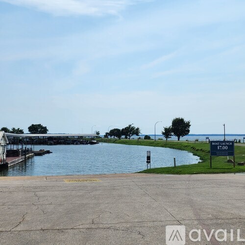 A sign in front of a body of water advertises a boat rental for $7.00.