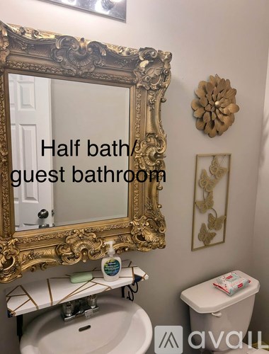 A bathroom with a mirror and a toilet.