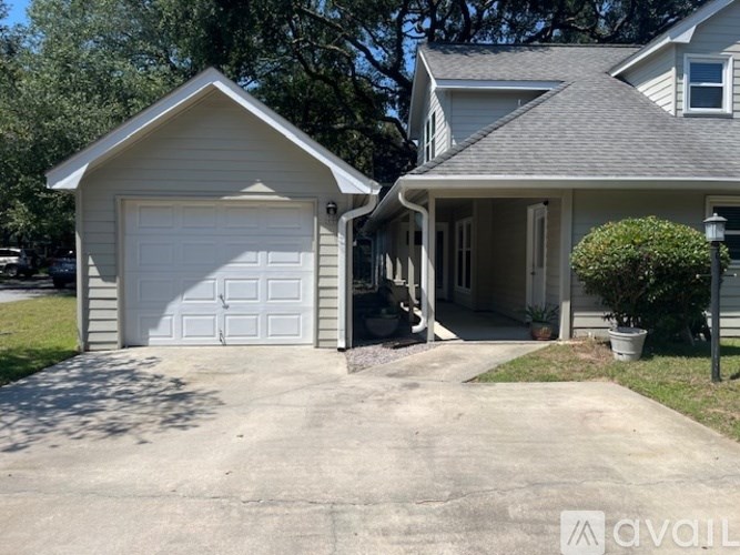 A two-car garage is attached to a house.