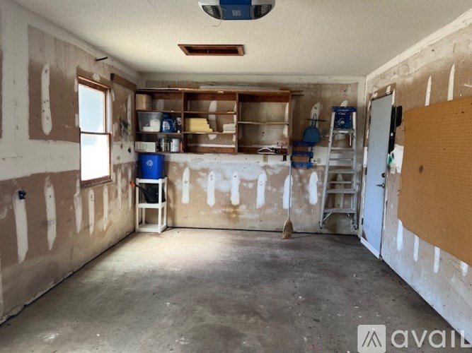 A room under construction with drywall installed on the walls.