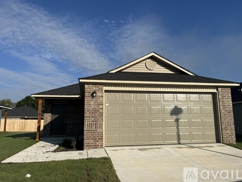 A house with a garage door in the front.