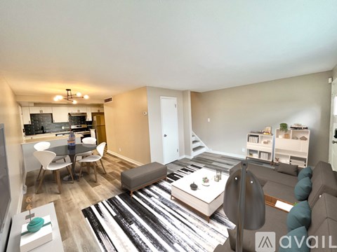 A living room with a grey couch and a coffee table.