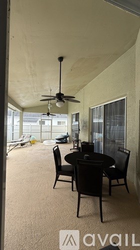 A patio with a table and chairs is shown.