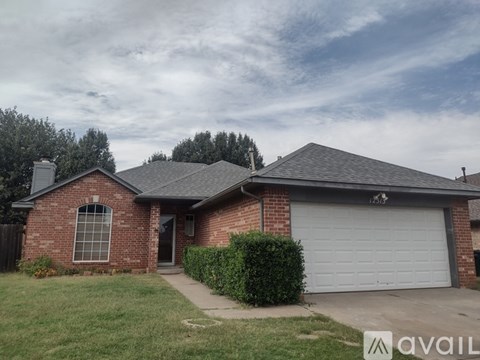 A house with a garage is for sale.