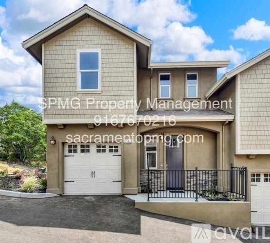 A house with the text "SPMG Property Management" and a phone number on it.