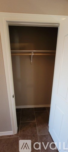 A white door with a handle is open.