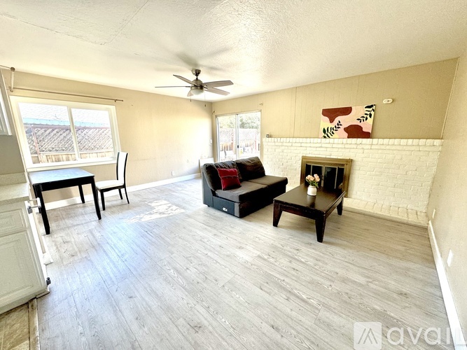 A living room with a fireplace and a couch.