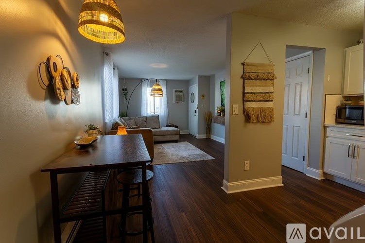 A kitchen with a table and chairs in the middle of the room.