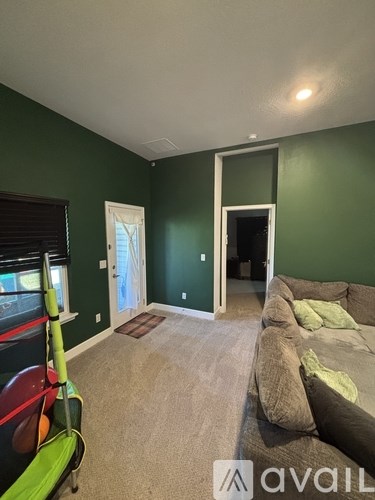 A living room with a couch and a chair.