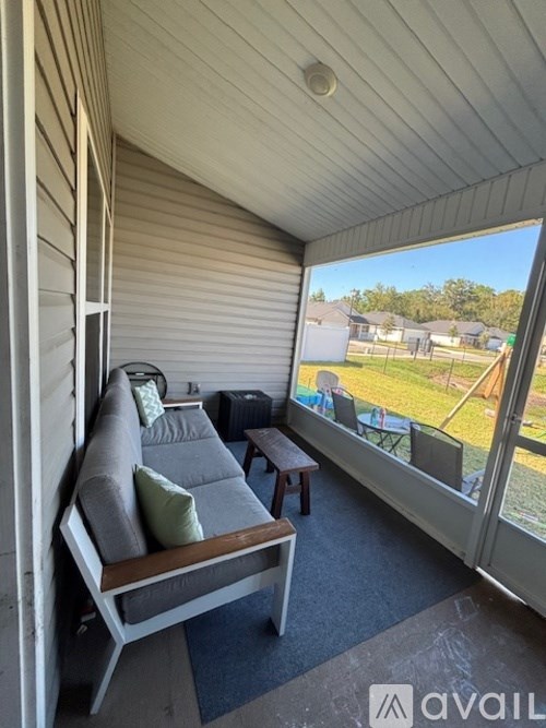A patio with a couch and a table is shown.