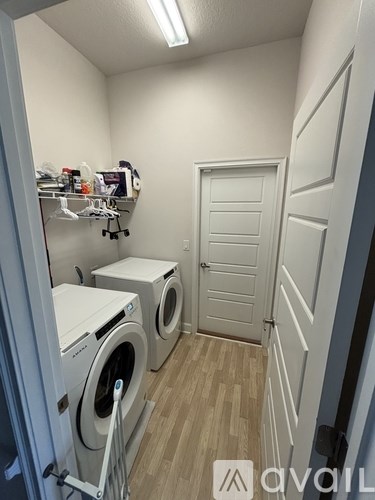A laundry room with a washer and dryer.