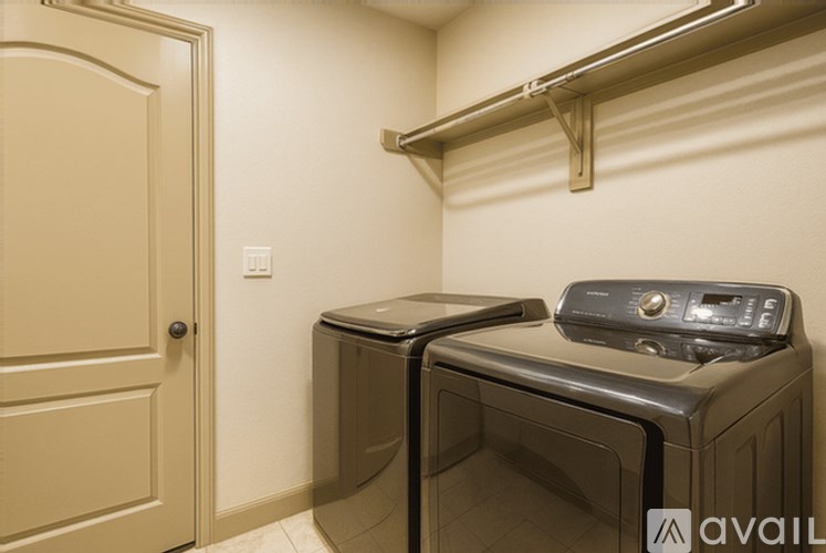 A black microwave oven is on top of a black dishwasher.