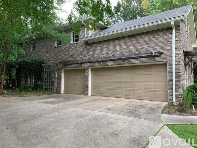 A house with a garage and a driveway.