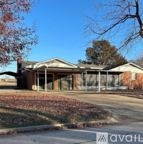 A house with a sign in front of it.