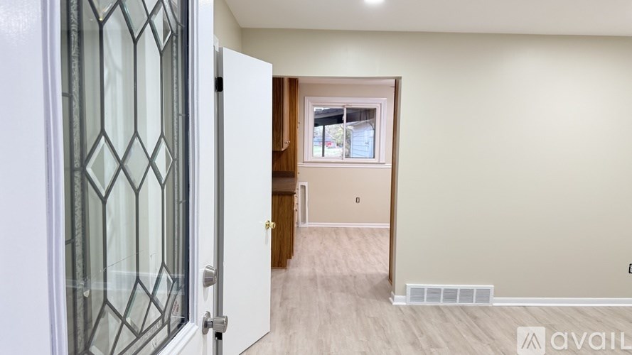 A room with a door and a window.