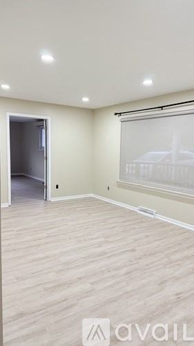 A room with a sliding door and a window.