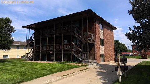A large two-story building with a balcony on the second floor.